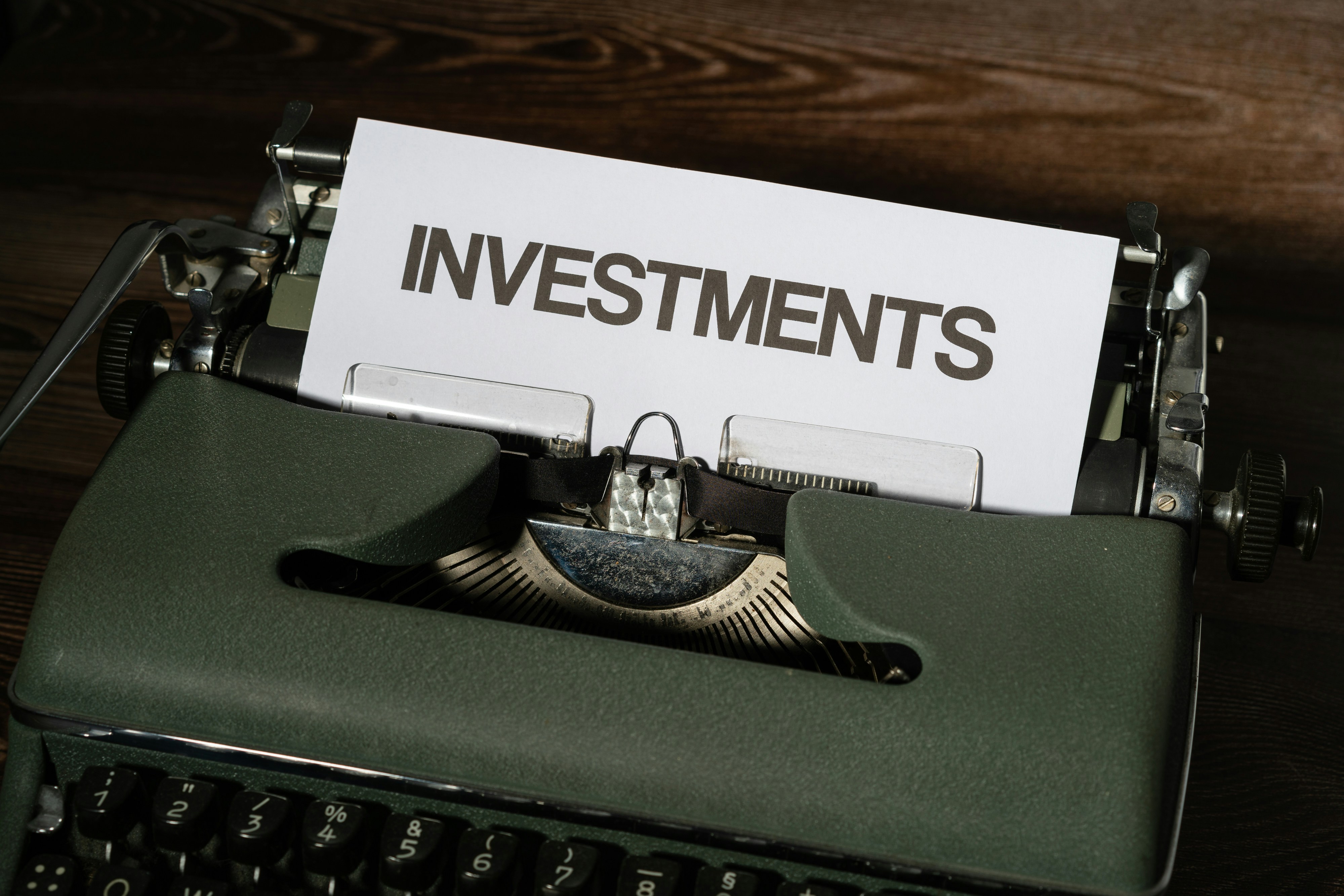 Typewriter with 'INVESTMENTS' paper inserted